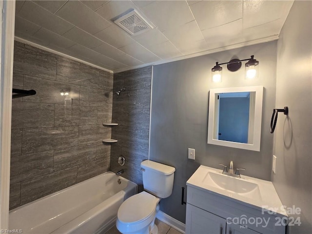 full bathroom with vanity, toilet, and tiled shower / bath