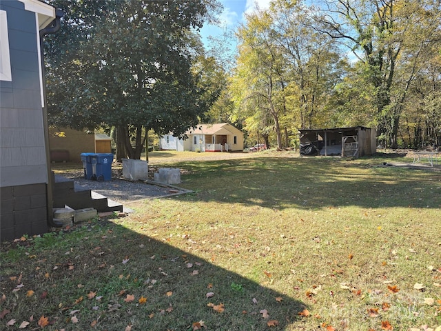 view of yard featuring a storage unit