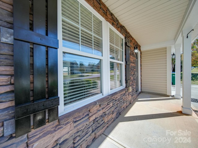 view of patio featuring a porch