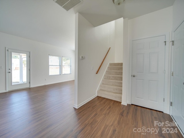 staircase with hardwood / wood-style flooring