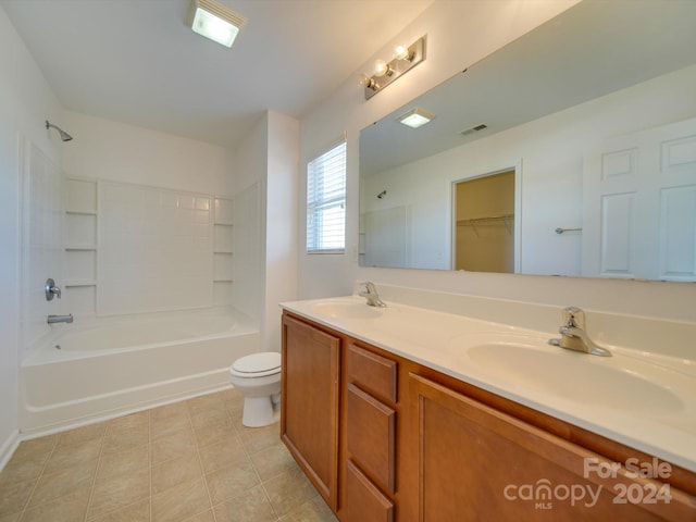 full bathroom with vanity, tub / shower combination, toilet, and tile patterned flooring