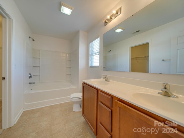 full bathroom featuring toilet, bathtub / shower combination, vanity, and tile patterned flooring