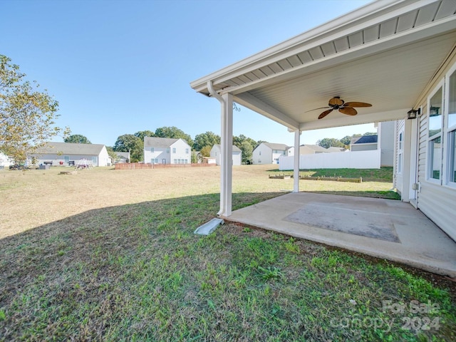 view of yard with a patio and ceiling fan