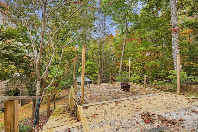 view of yard with an outdoor fire pit