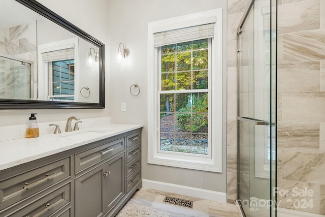 bathroom featuring vanity and a shower with shower door