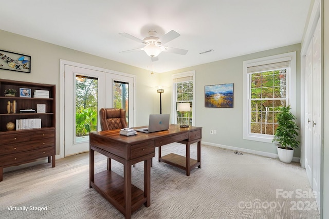 carpeted office featuring a healthy amount of sunlight and ceiling fan