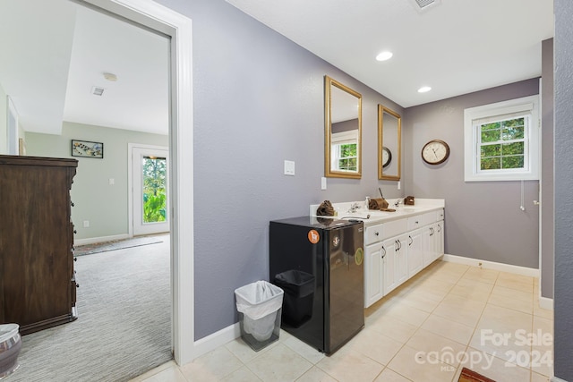 bathroom featuring vanity, tile patterned flooring, and a wealth of natural light