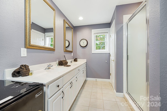 bathroom with vanity, tile patterned floors, and an enclosed shower