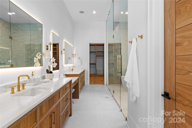 bathroom with vanity, tile patterned floors, and walk in shower