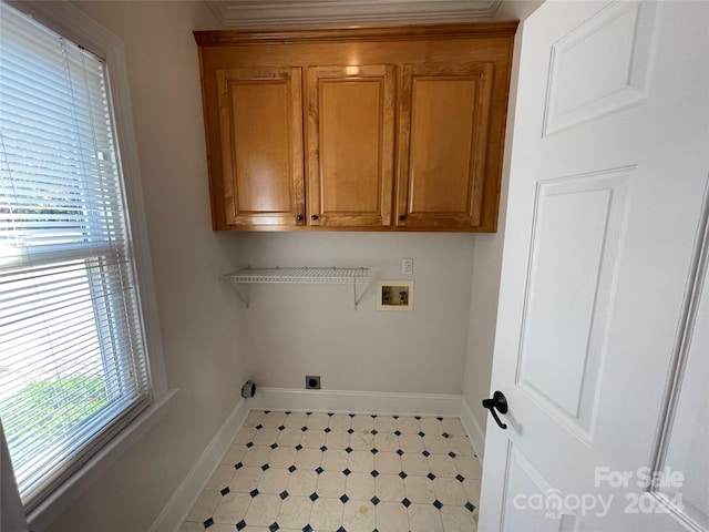 clothes washing area featuring hookup for an electric dryer, washer hookup, and cabinets