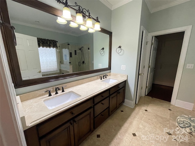 bathroom featuring a sink, a notable chandelier, ornamental molding, and a shower stall