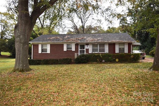 ranch-style house with a front lawn