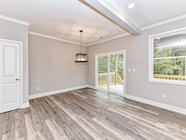 unfurnished dining area featuring beam ceiling, crown molding, and hardwood / wood-style flooring