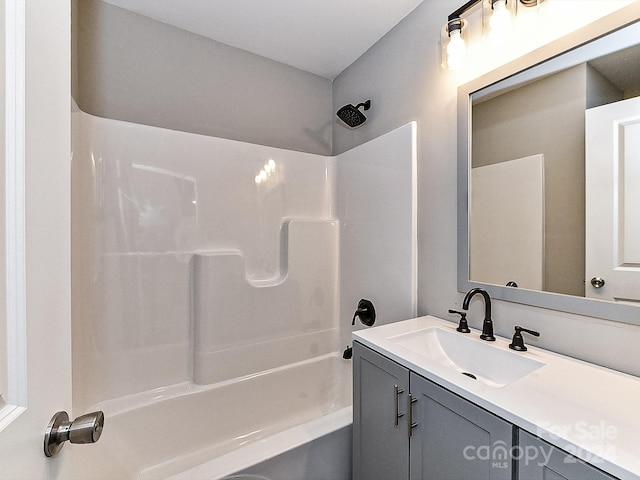 bathroom with vanity and  shower combination