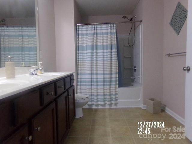 full bathroom with vanity, toilet, and shower / bath combo with shower curtain