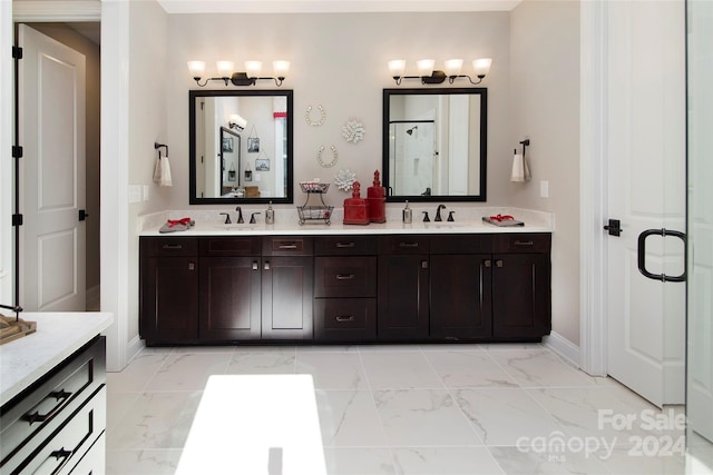 bathroom featuring vanity and a shower with door