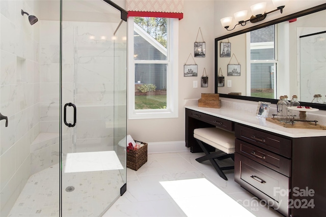 bathroom with a shower with door and vanity