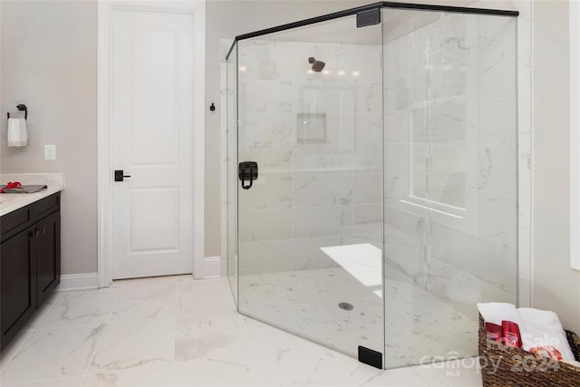 bathroom with a shower with door and vanity