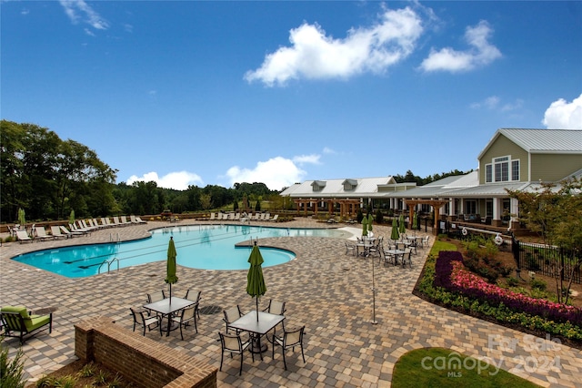 view of pool featuring a patio