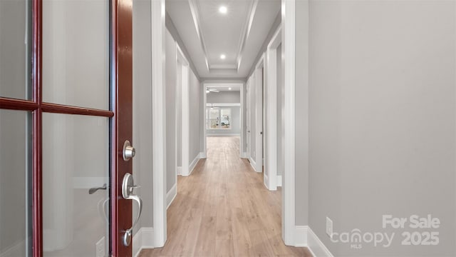 hallway featuring light wood-style floors, recessed lighting, and baseboards