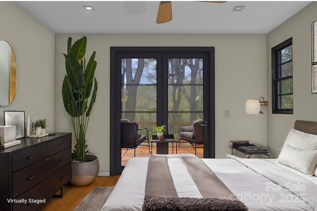 bedroom with ceiling fan and light wood-type flooring