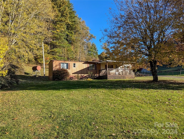 view of yard with a wooden deck