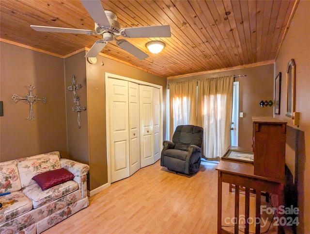 interior space featuring crown molding, wood ceiling, light wood-type flooring, and ceiling fan