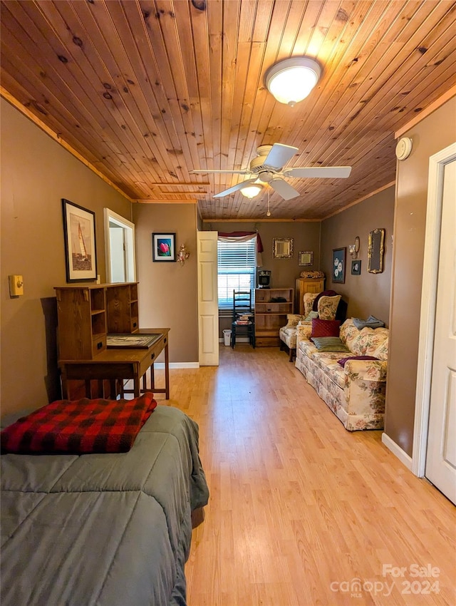 bedroom featuring crown molding, ceiling fan, light hardwood / wood-style floors, and wooden ceiling