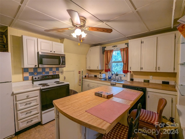 kitchen with white cabinets, ceiling fan, sink, and white appliances