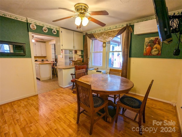 dining space featuring light hardwood / wood-style flooring and ceiling fan