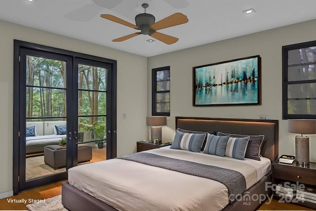 bedroom with ceiling fan, light hardwood / wood-style floors, access to outside, and french doors