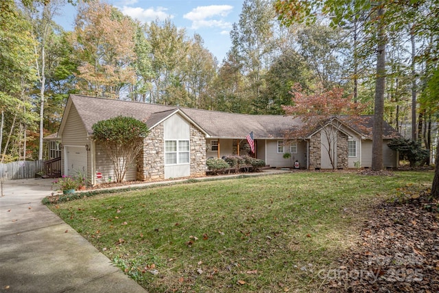 ranch-style home with a garage and a front yard