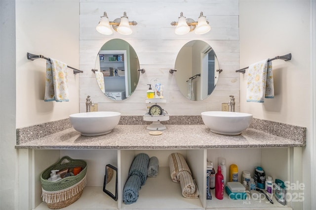 bathroom with tasteful backsplash and vanity