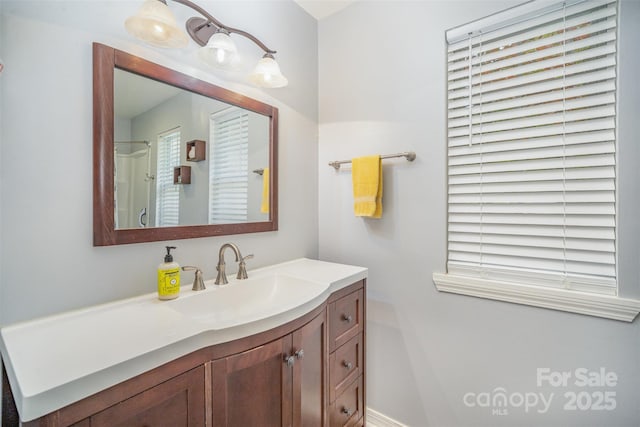 bathroom featuring vanity and walk in shower