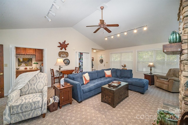 carpeted living room with lofted ceiling and ceiling fan