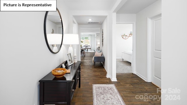 hall with dark hardwood / wood-style floors