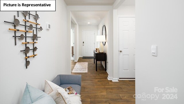 hallway with dark hardwood / wood-style flooring