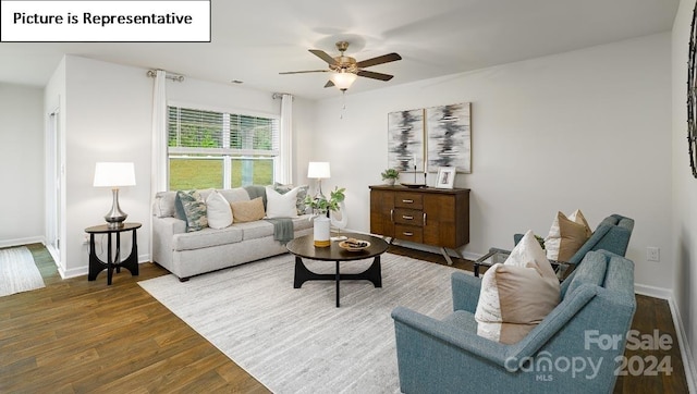 living room featuring ceiling fan and dark hardwood / wood-style flooring