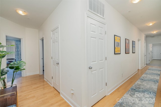 hallway featuring light hardwood / wood-style flooring