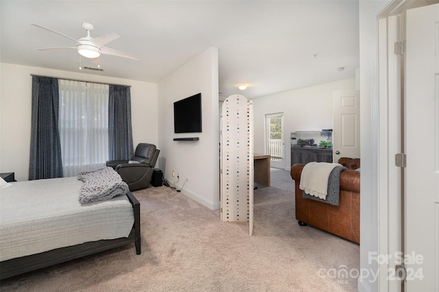 bedroom featuring light carpet and ceiling fan