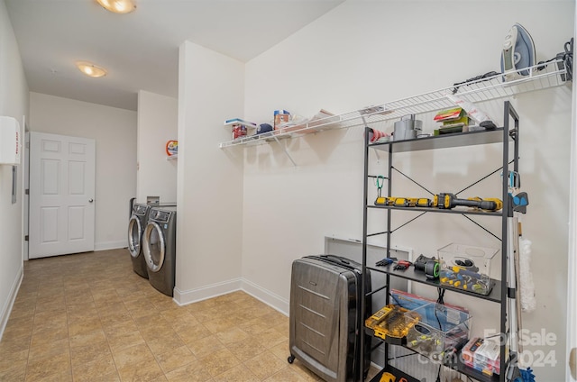 laundry area featuring washing machine and clothes dryer