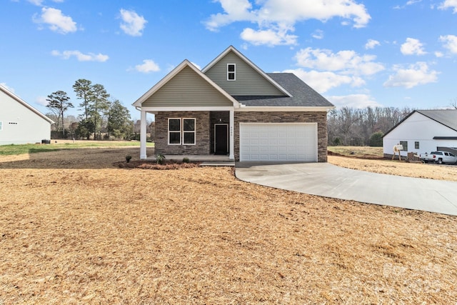 view of front of property featuring covered porch and a garage