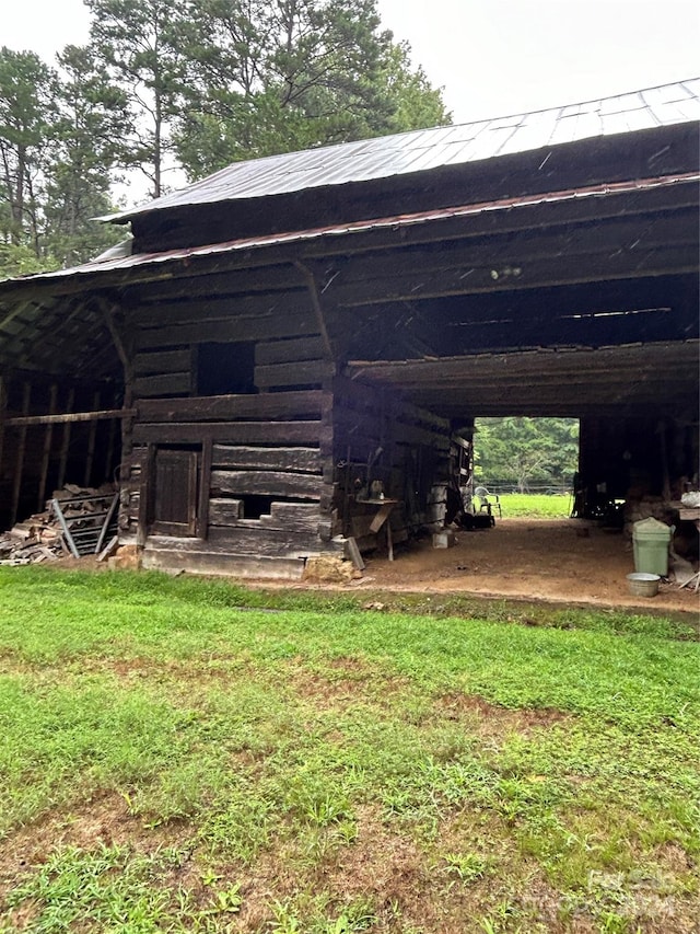 view of outbuilding with a lawn