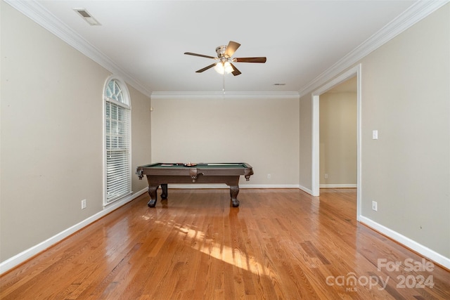 game room featuring light wood-type flooring, ornamental molding, and pool table