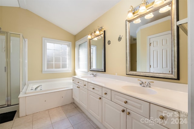 bathroom with plus walk in shower, vanity, tile patterned floors, and lofted ceiling