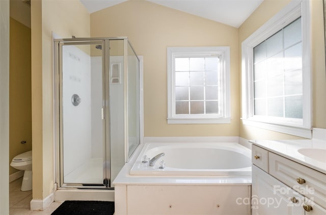 full bathroom with a healthy amount of sunlight, toilet, lofted ceiling, and shower with separate bathtub