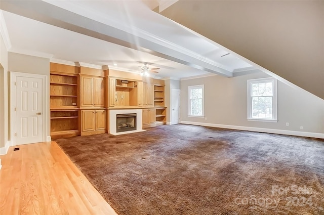 unfurnished living room with crown molding, ceiling fan, and hardwood / wood-style flooring