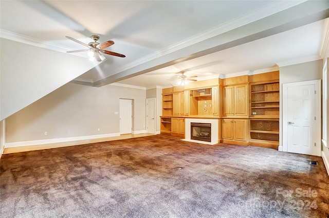 unfurnished living room with dark carpet, ceiling fan, and ornamental molding