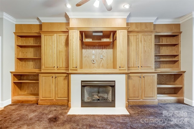 unfurnished living room with dark colored carpet, ceiling fan, and ornamental molding