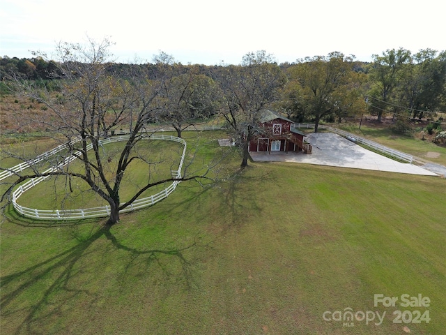 birds eye view of property with a rural view